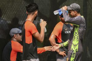 sports news pakistani cricketor malik shake hands with dhoni during practice match in dubai